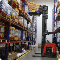 Forklift operating in distribution center