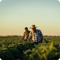 2 farmers standing in the middle of the field